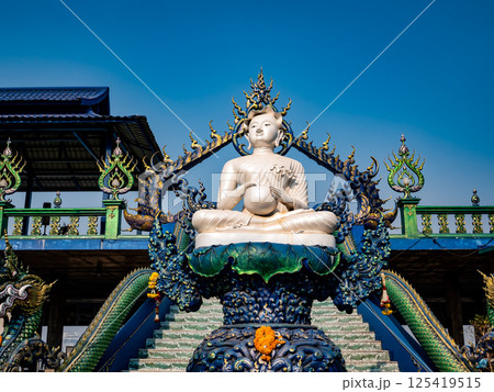 Chonburi, Thailand, Febuary 12, 2025, Samnaksong Khao Phra Khru features a serene sculpture surrounded by intricate designs and vibrant colors. 125419515