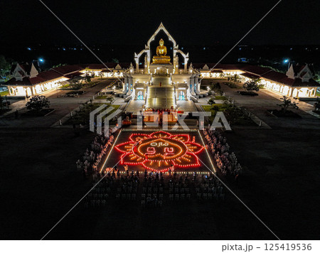 Lopburi, Thailand, April 12, 2025, Celebration at Puttha Sathan Lopburi Sri Suvarnabhumi with illuminated designs and gathered devotees 125419536
