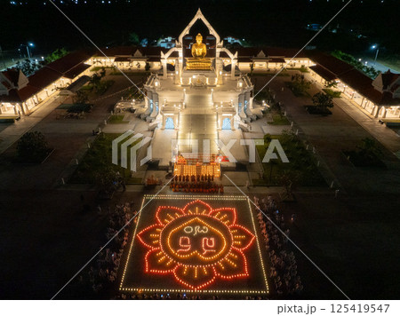 Lopburi, Thailand, April 12, 2025, Visitors gather at Puttha Sathan Lopburi Sri Suvarnabhumi in Lopburi, Thailand, for a nighttime cultural celebration with festive lights and traditional displays in Lopburi, Thailand, April 12, 2025, Visitors gather at Puttha Sathan Lopburi Sri Suvarnabhumi in Lopburi, Thailand, for a nighttime cultural celebration with festive lights and traditional displays in 125419547