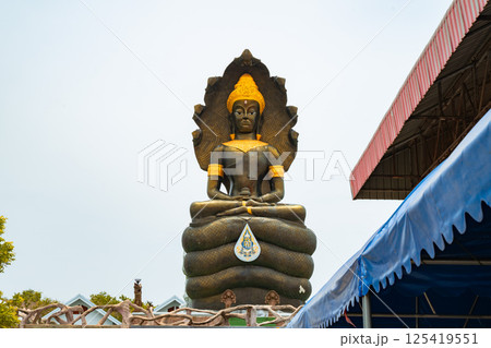 Lopburi, Thailand, April 14, 2025, Giant Buddha statue at Wat Tamtako, surrounded by tranquil scenery Lopburi, Thailand, April 14, 2025, Giant Buddha statue at Wat Tamtako, surrounded by tranquil scenery 125419551