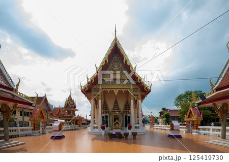 Nonthaburi, Thailand, March 15, 2025, Wat Samon Kot showcases intricate architecture under a cloudy sky 125419730
