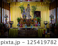 Singburi, Thailand, March 23, 2025, Wat Phra Non Chak Si Worawihan shrine, showcases colorful statues and offerings 125419782