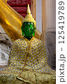 Singburi, Thailand, March 23, 2025, Stunning emerald Buddha statue adorned with intricate golden clothing at Wat Phra Non Chak Si Worawihan 125419789