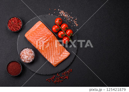 Fresh raw salmon steak with spices and herbs Fresh raw salmon steak with spices and herbs 125421879