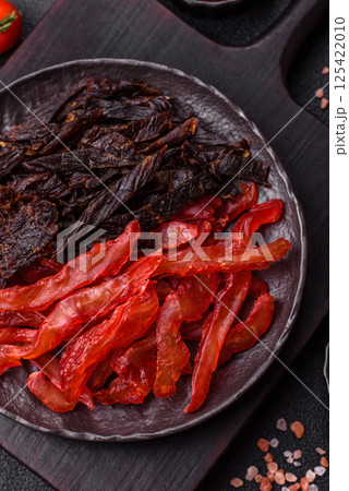 Jerky, dried chicken slices with salt and spices 125422010