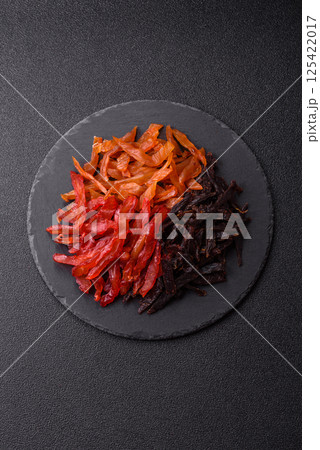 Jerky, dried chicken slices with salt and spices Jerky, dried chicken slices with salt and spices 125422017