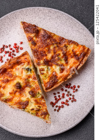 Delicious fresh quiche with broccoli, cheese, spices and herbs Delicious fresh quiche with broccoli, cheese, spices and herbs 125422041