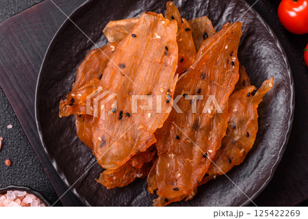 Jerky, dried chicken meat with salt and spices 125422269