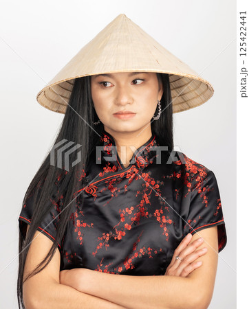 Portrait of Asian woman with cone-shaped Asian cane hat 125422441