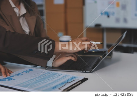 Accounting company provide finance and taxation planning for profitable cash flow, Auditor and accountant team working in office, analyze financial data and accounting record with calculator.Insight Accounting company provide finance and taxation planning for profitable cash flow, Auditor and accountant team working in office, analyze financial data and accounting record with calculator.Insight 125422859