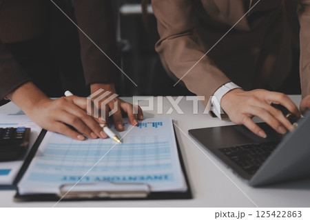 Accounting company provide finance and taxation planning for profitable cash flow, Auditor and accountant team working in office, analyze financial data and accounting record with calculator.Insight Accounting company provide finance and taxation planning for profitable cash flow, Auditor and accountant team working in office, analyze financial data and accounting record with calculator.Insight 125422863