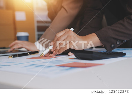 Accounting company provide finance and taxation planning for profitable cash flow, Auditor and accountant team working in office, analyze financial data and accounting record with calculator.Insight Accounting company provide finance and taxation planning for profitable cash flow, Auditor and accountant team working in office, analyze financial data and accounting record with calculator.Insight 125422878