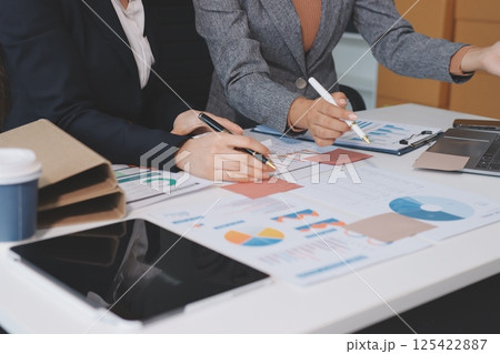 Accounting company provide finance and taxation planning for profitable cash flow, Auditor and accountant team working in office, analyze financial data and accounting record with calculator.Insight Accounting company provide finance and taxation planning for profitable cash flow, Auditor and accountant team working in office, analyze financial data and accounting record with calculator.Insight 125422887