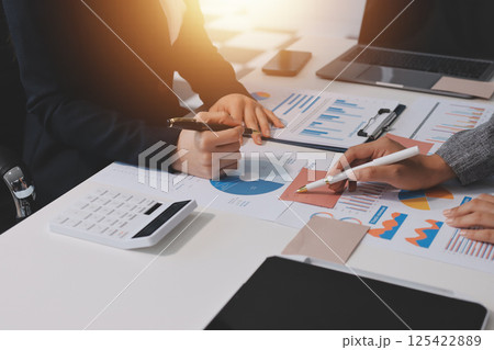 Accounting company provide finance and taxation planning for profitable cash flow, Auditor and accountant team working in office, analyze financial data and accounting record with calculator.Insight Accounting company provide finance and taxation planning for profitable cash flow, Auditor and accountant team working in office, analyze financial data and accounting record with calculator.Insight 125422889