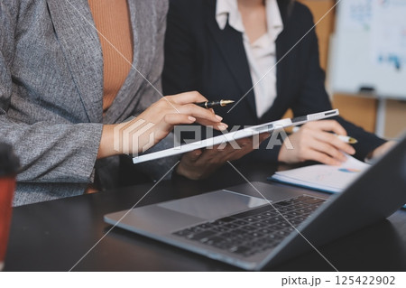 Accounting company provide finance and taxation planning for profitable cash flow, Auditor and accountant team working in office, analyze financial data and accounting record with calculator.Insight Accounting company provide finance and taxation planning for profitable cash flow, Auditor and accountant team working in office, analyze financial data and accounting record with calculator.Insight 125422902