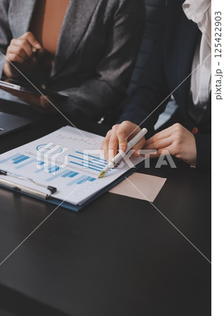 Accounting company provide finance and taxation planning for profitable cash flow, Auditor and accountant team working in office, analyze financial data and accounting record with calculator.Insight Accounting company provide finance and taxation planning for profitable cash flow, Auditor and accountant team working in office, analyze financial data and accounting record with calculator.Insight 125422903