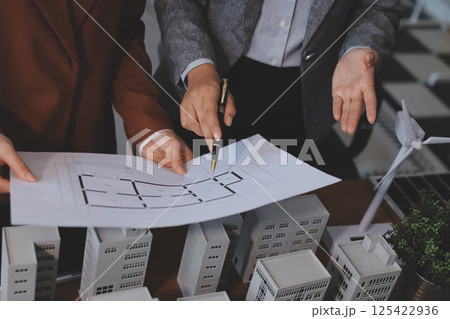 Discussion among businesspeople on the latest developments in solar cell panel technology and Solar Energy Environment city Concept. Discussion among businesspeople on the latest developments in solar cell panel technology and Solar Energy Environment city Concept. 125422936