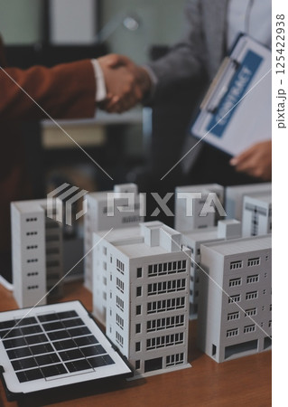 Discussion among businesspeople on the latest developments in solar cell panel technology and Solar Energy Environment city Concept. Discussion among businesspeople on the latest developments in solar cell panel technology and Solar Energy Environment city Concept. 125422938