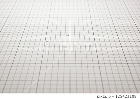 gray cutting mat board background with line and scale measure guide pattern for object art design gray cutting mat board background with line and scale measure guide pattern for object art design 125423109