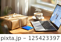 credit card in a cardboard box and laptop 125423397