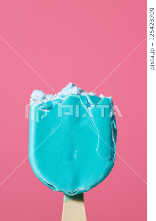 blue ice cream bar on wooden stick 125423709