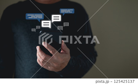 man using smartphone and touch icon social media for online marketing, work from anywhere. technology internet networking, playing social media and living on holiday concept. 125425137