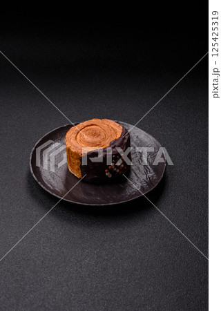 Round sweet New York roll croissant with chocolate cream filling Round sweet New York roll croissant with chocolate cream filling 125425319