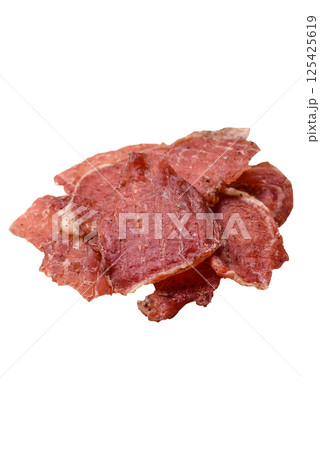 Jerky, dried pork meat slices with salt and spices 125425619