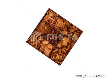 Crispy homemade brown bread chips with seeds and grains Crispy homemade brown bread chips with seeds and grains 125425636