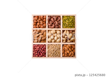 Mix of macadamia, pine, cashew, hazelnut, peanut, pistachio nuts 125425680