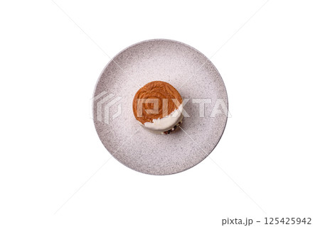 Round sweet New York roll croissant with pistachio cream filling 125425942