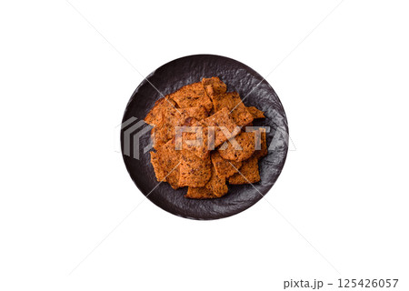 Crispy homemade brown bread chips with seeds and grains Crispy homemade brown bread chips with seeds and grains 125426057