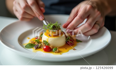 Chef plating dessert with herbs, candied vegetables, savory sauces, minimalist plate, creative and innovative food art 125426099