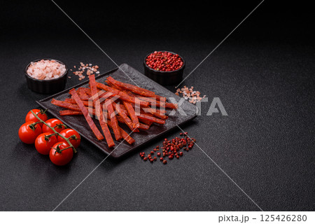 Jerky dried fish sticks with salt and spices Jerky dried fish sticks with salt and spices 125426280