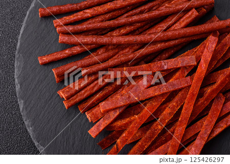 Jerky dried fish sticks with salt and spices Jerky dried fish sticks with salt and spices 125426297