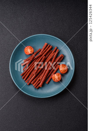 Jerky dried fish sticks with salt and spices Jerky dried fish sticks with salt and spices 125426344