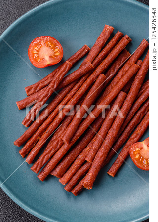 Jerky dried fish sticks with salt and spices Jerky dried fish sticks with salt and spices 125426348