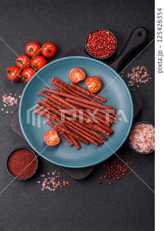 Jerky dried fish sticks with salt and spices Jerky dried fish sticks with salt and spices 125426354