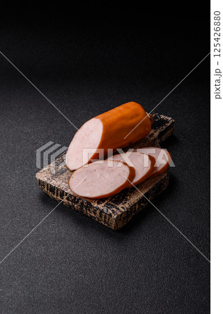 Delicious fresh boiled chicken or pork sausage cut into slices 125426880