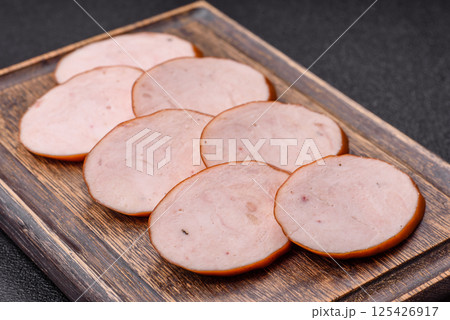 Delicious fresh boiled chicken or pork sausage cut into slices 125426917