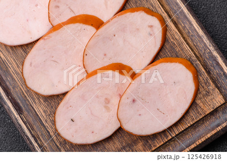 Delicious fresh boiled chicken or pork sausage cut into slices 125426918