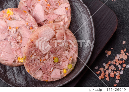 Homemade brawn with salt, spices, herbs and vegetables Homemade brawn with salt, spices, herbs and vegetables 125426949
