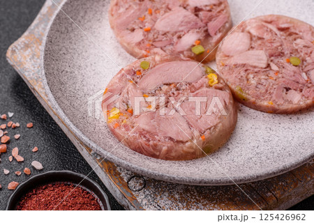 Homemade brawn with salt, spices, herbs and vegetables 125426962