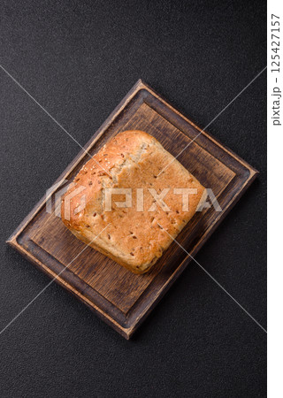 Brown bread with grains and seeds 125427157