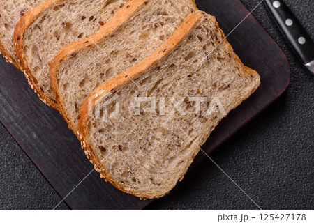 Brown bread with grains and seeds Brown bread with grains and seeds 125427178