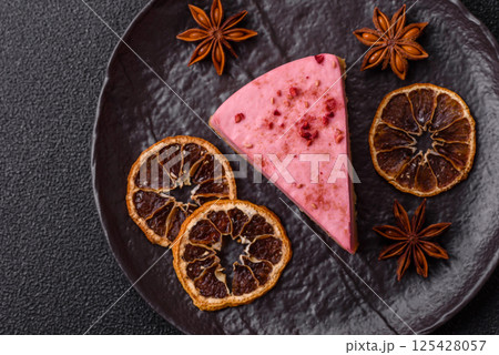 A piece of sweet cheesecake with raspberry or strawberry flavor A piece of sweet cheesecake with raspberry or strawberry flavor 125428057