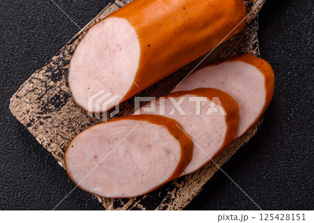Delicious fresh boiled chicken or pork sausage cut into slices 125428151