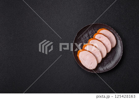 Delicious fresh boiled chicken or pork sausage cut into slices 125428163