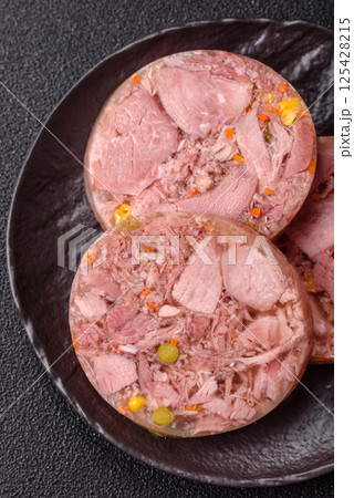 Homemade brawn with salt, spices, herbs and vegetables Homemade brawn with salt, spices, herbs and vegetables 125428215