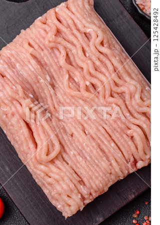 Raw minced chicken with salt, spices and herbs 125428492